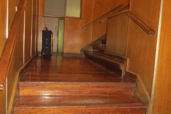 View of the two small 4 step stairs in the building entrance hall.