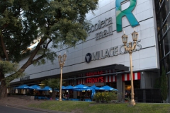 Street lamps and trees before the Recoleta Mall entrance